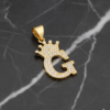 Dije Letra G Corona Real Bañado