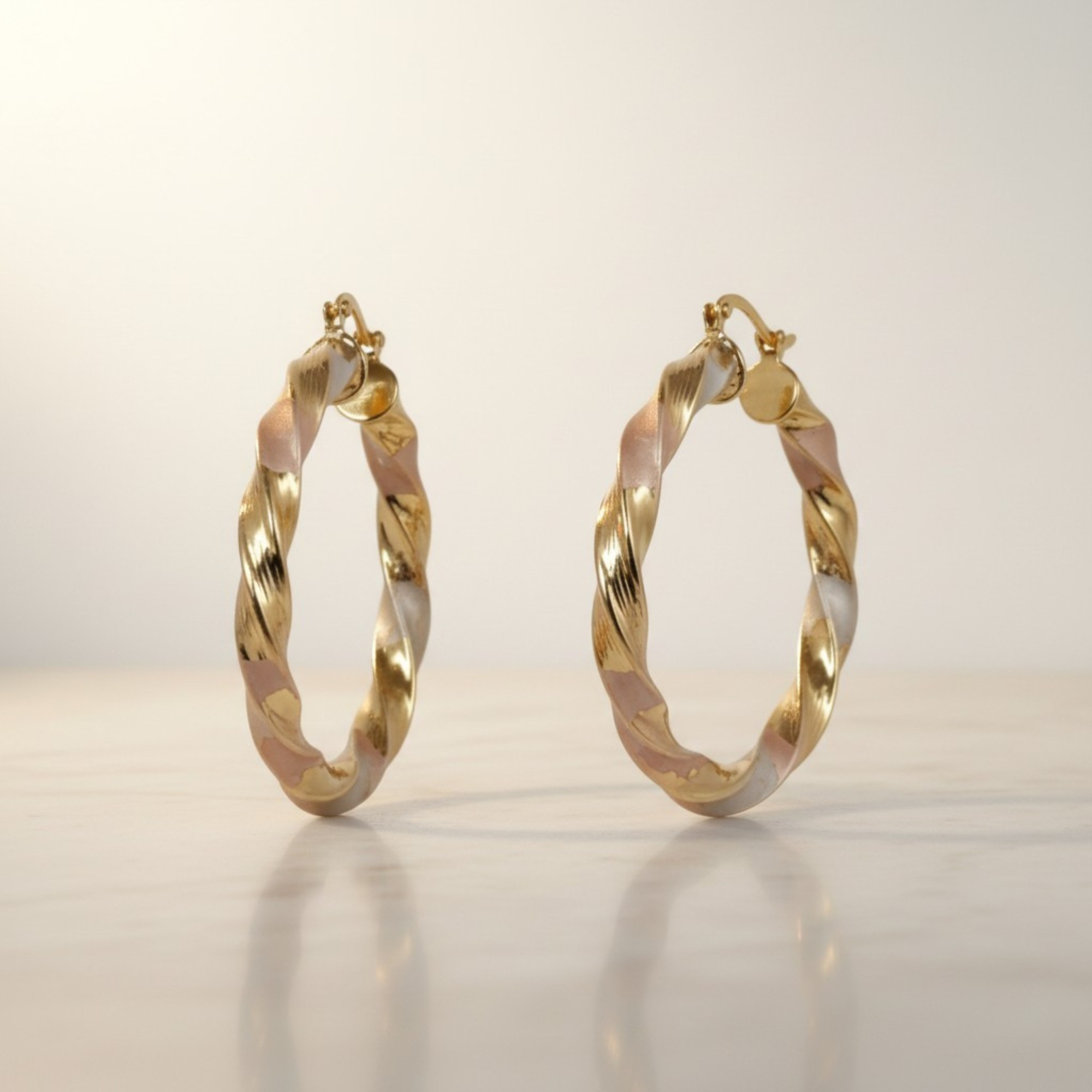 argollas trenzadas en oro laminado